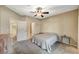 Bedroom featuring a ceiling fan, a carpet flooring and ensuite bathroom at 8717 Red Brook Dr # 201, Las Vegas, NV 89128