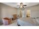 Bedroom featuring a ceiling fan, carpet flooring and a sitting chair at 8717 Red Brook Dr # 201, Las Vegas, NV 89128