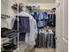 Walk-in closet featuring wire shelving, hanging clothes, and visible shoes at 8717 Red Brook Dr # 201, Las Vegas, NV 89128