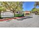 Elegant community entrance featuring lush landscaping and a welcoming sign at 8717 Red Brook Dr # 201, Las Vegas, NV 89128