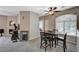 Bright dining area features carpet flooring, a ceiling fan, and lots of natural light at 8717 Red Brook Dr # 201, Las Vegas, NV 89128