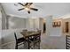 Dining area with a ceiling fan, view of the kitchen, and easy access to the hall at 8717 Red Brook Dr # 201, Las Vegas, NV 89128