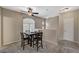 Upstairs dining area with carpeted floor, a ceiling fan, and natural light at 8717 Red Brook Dr # 201, Las Vegas, NV 89128