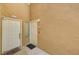 Exterior entryway featuring unit doors and stucco facade at 8717 Red Brook Dr # 201, Las Vegas, NV 89128