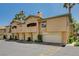 A townhome complex with private garages, neutral paint, and well manicured landscaping at 8717 Red Brook Dr # 201, Las Vegas, NV 89128