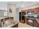 Modern kitchen features stainless steel appliances, wood cabinets, and granite countertops at 8717 Red Brook Dr # 201, Las Vegas, NV 89128