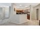 Inviting half wall view into the kitchen from the living room and stairs at 8717 Red Brook Dr # 201, Las Vegas, NV 89128