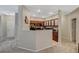 Modern kitchen with wood cabinets and partial dividing wall at 8717 Red Brook Dr # 201, Las Vegas, NV 89128