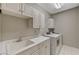 Laundry room with a utility sink and a washer and dryer at 8717 Red Brook Dr # 201, Las Vegas, NV 89128