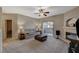 Inviting living room with fireplace and sliding glass door to balcony at 8717 Red Brook Dr # 201, Las Vegas, NV 89128