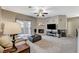 Comfortable living room with a fireplace, television, and sliding door to a patio at 8717 Red Brook Dr # 201, Las Vegas, NV 89128