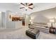 Spacious living room with a plush sofa, cozy ottoman, and views of the modern kitchen at 8717 Red Brook Dr # 201, Las Vegas, NV 89128