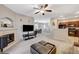 Inviting living room with fireplace, open layout, and seamless flow to the kitchen at 8717 Red Brook Dr # 201, Las Vegas, NV 89128
