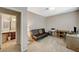 Neutral office space with desk setup, carpet flooring, and adjacent access to bathroom at 8717 Red Brook Dr # 201, Las Vegas, NV 89128