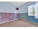 A blue bedroom featuring two-tone paint and wood laminate flooring at 8849 Pheasant Valley Way, Las Vegas, NV 89123