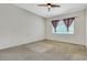Bedroom featuring plain walls, neutral carpet and a ceiling fan at 8849 Pheasant Valley Way, Las Vegas, NV 89123