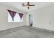 Bright bedroom with neutral walls, curtains, and access to the ensuite bathroom at 8849 Pheasant Valley Way, Las Vegas, NV 89123