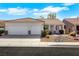 Charming single-story home featuring a two-car garage, neutral paint, and landscaped front yard at 8849 Pheasant Valley Way, Las Vegas, NV 89123
