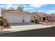 Attractive single-story home with a two-car garage, mature landscaping, and a tile roof at 8849 Pheasant Valley Way, Las Vegas, NV 89123