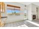 Eat-in kitchen with tile floors, plenty of cabinet space, fireplace, and backyard access at 8849 Pheasant Valley Way, Las Vegas, NV 89123
