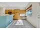 Open eat-in kitchen featuring tile floors, breakfast bar, wooden cabinets and lots of natural light at 8849 Pheasant Valley Way, Las Vegas, NV 89123