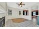 Bright living area with tile floors, fireplace, and ceiling fan at 8849 Pheasant Valley Way, Las Vegas, NV 89123
