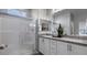 Modern bathroom with double sinks, granite countertops, and a glass-enclosed shower at 899 Apatite Pl # Lot 61, Henderson, NV 89011