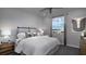 Cozy bedroom featuring a comfortable bed and a large window at 899 Apatite Pl # Lot 61, Henderson, NV 89011