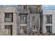 Modern three-story townhome with private balconies and stone accents at 899 Apatite Pl # Lot 61, Henderson, NV 89011
