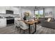 Open-concept living room with hardwood floors connecting to the kitchen at 899 Apatite Pl # Lot 61, Henderson, NV 89011