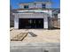 New construction home with a two car garage awaiting finishing touches on a sunny day at 9240 Dekalb Ct, Las Vegas, NV 89148