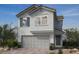 Charming two-story home featuring a two-car garage, neutral paint and simple, clean landscaping at 9246 Dekalb Ct, Las Vegas, NV 89148
