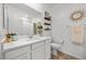 Bathroom featuring bright lighting, a single vanity and decorative shelving at 965 Nevada State Dr # 41201, Henderson, NV 89002