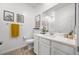Bright bathroom featuring a vanity with a white countertop and framed desert art at 965 Nevada State Dr # 41201, Henderson, NV 89002