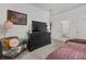 Bedroom features a comfy chair, dark dresser and an en suite bathroom at 965 Nevada State Dr # 41201, Henderson, NV 89002