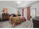 Comfortable bedroom featuring soft gray carpet, a queen-size bed and stylish decor at 965 Nevada State Dr # 41201, Henderson, NV 89002