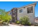 Modern two-story building featuring stone accents, well-maintained landscaping, and clear signage, with desert landscaping in view at 965 Nevada State Dr # 41201, Henderson, NV 89002