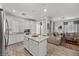 Open-concept space with a kitchen island, stainless steel appliances, a dining area, and a living room at 965 Nevada State Dr # 41201, Henderson, NV 89002