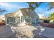 Exterior shot of the backyard and patio, with bright sunlight and lush foliage at 9741 Horizon Hills Dr, Las Vegas, NV 89117