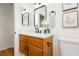 Bathroom featuring a single sink vanity, wood floors, and modern decorations at 9741 Horizon Hills Dr, Las Vegas, NV 89117