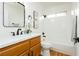 Bathroom featuring a shower-tub combo, wood floors, and a single sink vanity at 9741 Horizon Hills Dr, Las Vegas, NV 89117