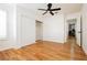 Bedroom with wood floor, ceiling fan, and wardrobe with sliding doors at 9741 Horizon Hills Dr, Las Vegas, NV 89117