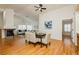 Open-concept dining room with hardwood floors, fireplace, and modern decor at 9741 Horizon Hills Dr, Las Vegas, NV 89117