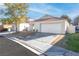 Charming single-story home featuring a two-car garage and desert landscaping at 9741 Horizon Hills Dr, Las Vegas, NV 89117