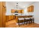 Updated kitchen features wood floors and seating at the peninsula at 9741 Horizon Hills Dr, Las Vegas, NV 89117