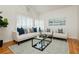 Cozy living room featuring a modern sofa set and a large window at 9741 Horizon Hills Dr, Las Vegas, NV 89117