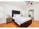 Bedroom featuring wood floors, ceiling fan, plantation shutters and ensuite bathroom at 9741 Horizon Hills Dr, Las Vegas, NV 89117