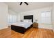 Bedroom with wood floors, a ceiling fan, and plantation shutters at 9741 Horizon Hills Dr, Las Vegas, NV 89117