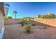 Cozy backyard with desert landscaping, privacy fence, and potential for outdoor living space at 9844 Ashton Pines Ct, Las Vegas, NV 89147