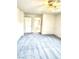 Bright, carpeted bedroom with an overhead fan and closet, offering a comfortable retreat at 9844 Ashton Pines Ct, Las Vegas, NV 89147